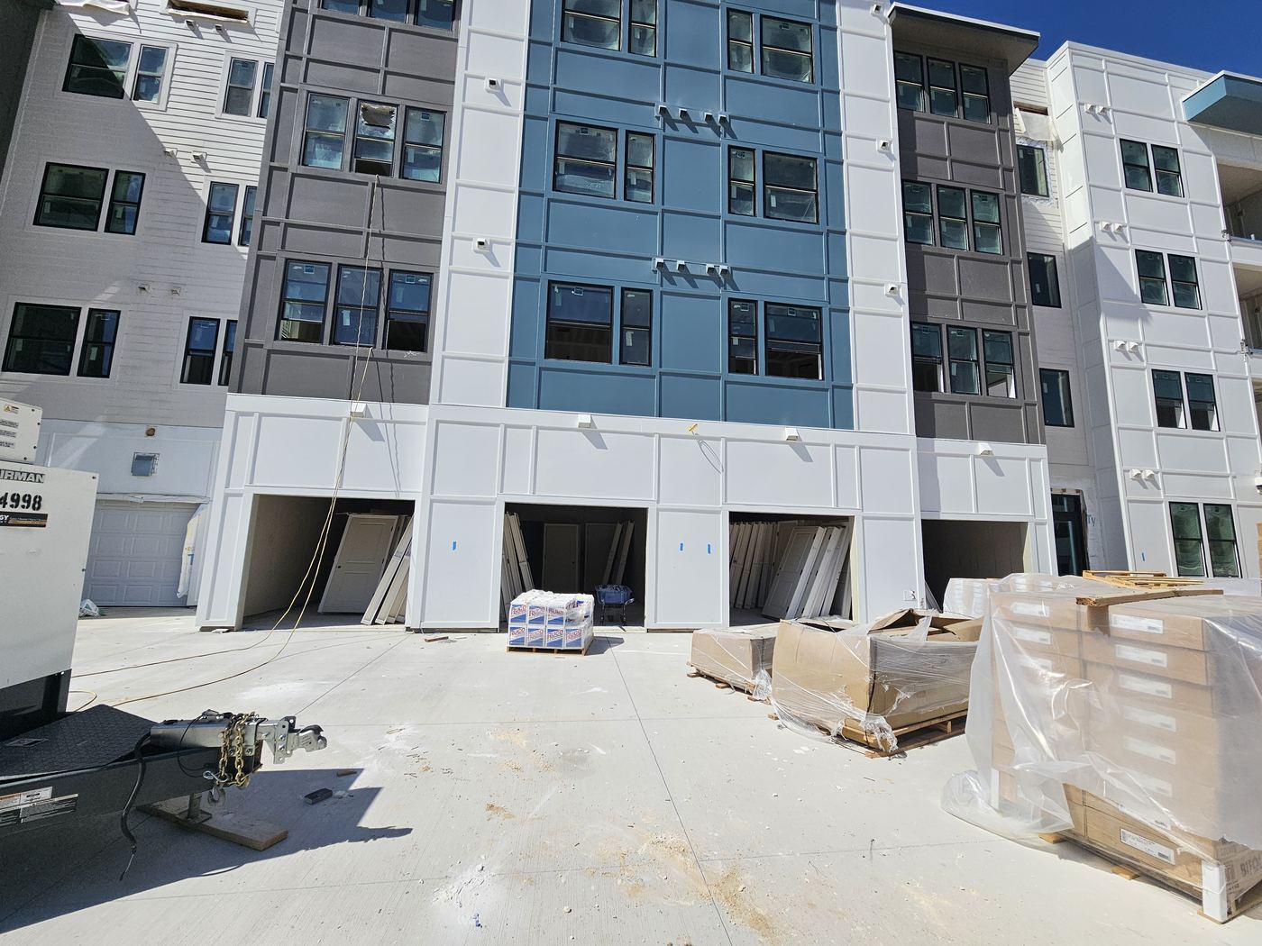 Multifamily building with siding in progress